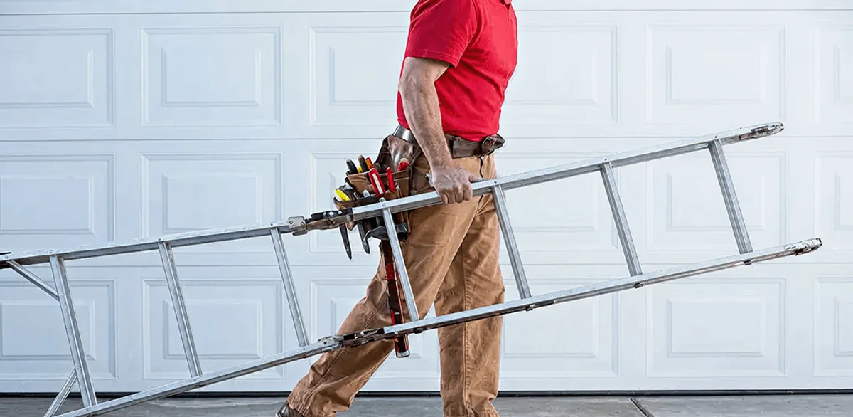 Garage door repair technician arriving with tools and ladder in Tallahassee, FL